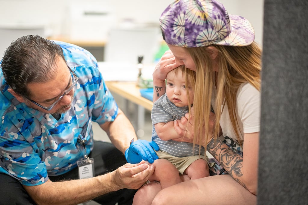 One-year-old River Jacobs is held by his mother, Caitlin Fuller, while he receives an MMR vaccine from Raynard Covarrubio, at a vaccine clinic put on by Lubbock Public Health Department on March 1, in Lubbock, Texas. Photo: TNS One-year-old River Jacobs is held by his mother, Caitlin Fuller, while he receives an MMR vaccine from Raynard Covarrubio, at a vaccine clinic put on by Lubbock Public Health Department on March 1, in Lubbock, Texas. Photo: TNS