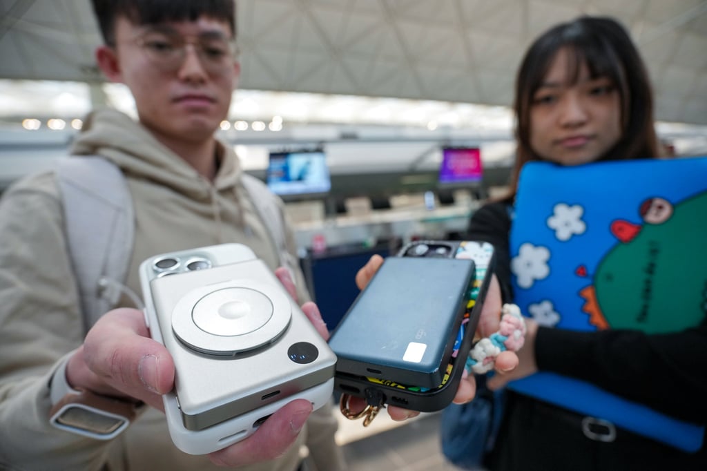 Passengers such as Rain Poon (left) and Kinki Yue won’t be able to use power banks on flights. Photo: May Tse Passengers such as Rain Poon (left) and Kinki Yue won’t be able to use power banks on flights. Photo: May Tse