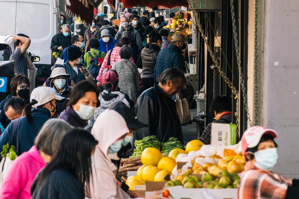Pedestrians walk along a crowded Stockton Street in San Francisco’s Chinatown. Photo: Getty Images