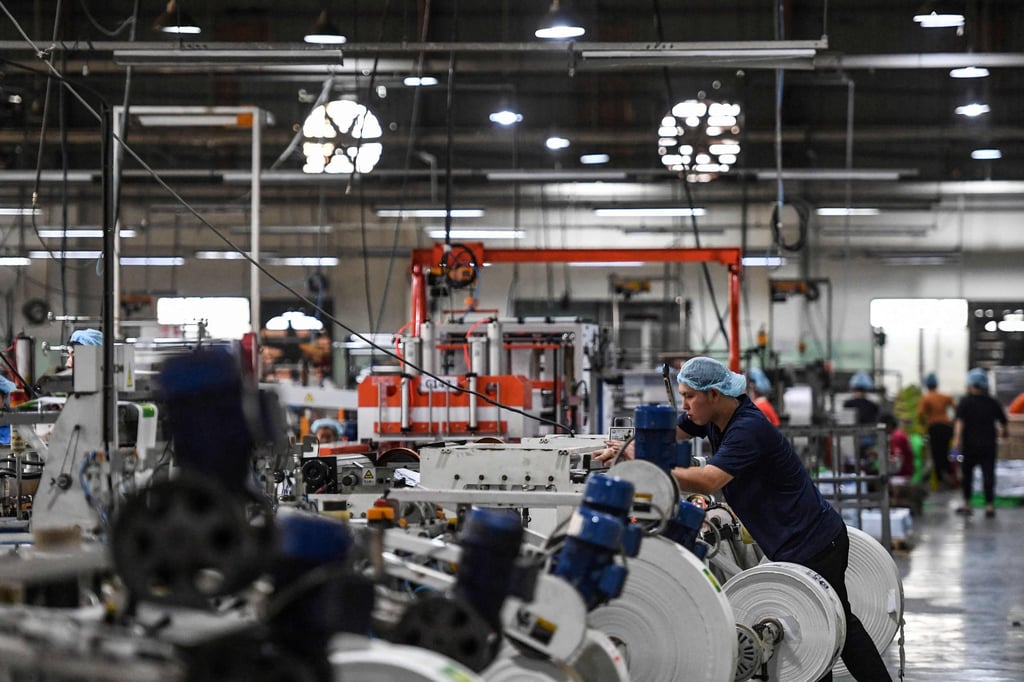 An employee working inside a packaging factory of Nam Thai Son Group in Ho Chi Minh City. Photo: AFP An employee working inside a packaging factory of Nam Thai Son Group in Ho Chi Minh City. Photo: AFP