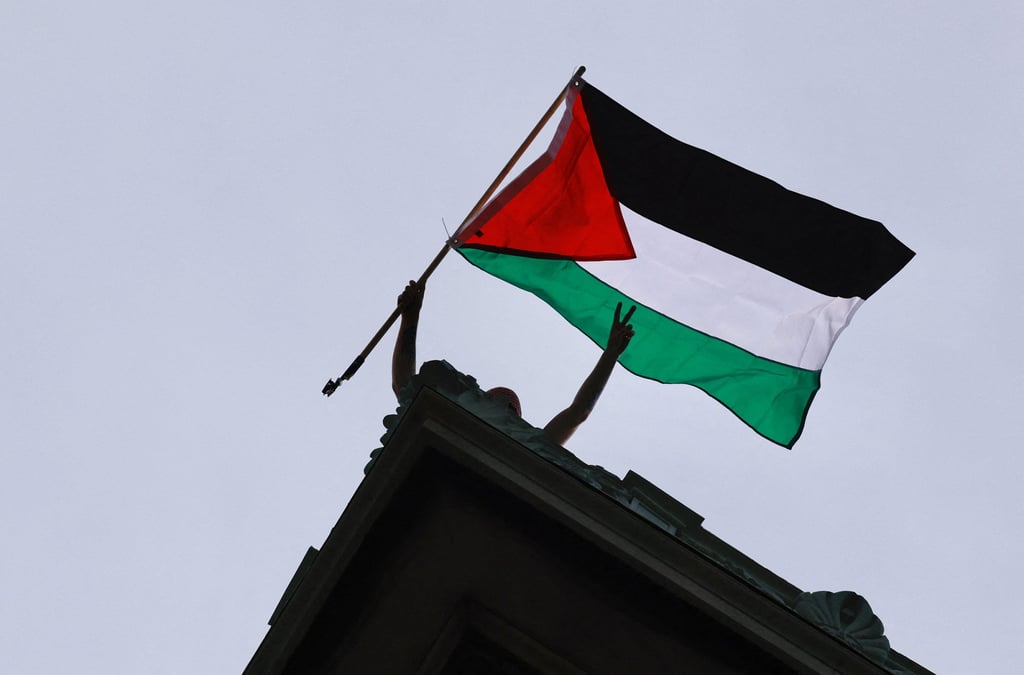 A protester waves a Palestinian flag during a demonstration at Columbia University in New York in April 2024. Photo: TNS