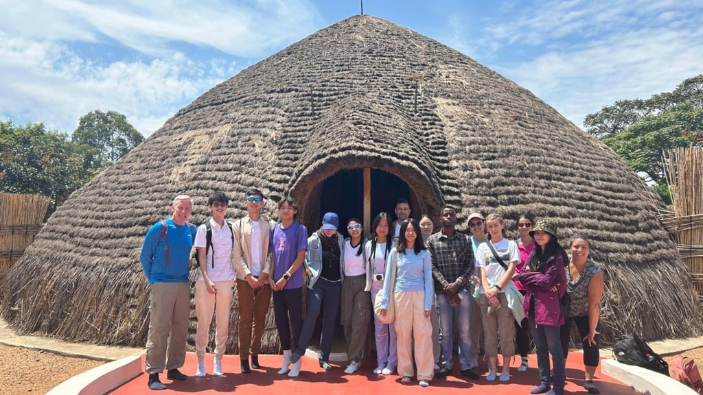 Sean Lynch, head of school at CIS, (first left) with colleagues and students during the Project Week trip to Rwanda, where they helped to teach English to children in Kigali.