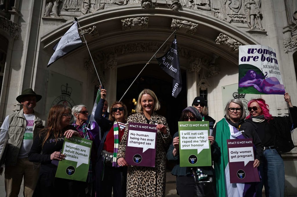 Activists celebrate the outcome of the Supreme Court’s ruling on how to define a “woman”, in London on Wednesday. Photo: AFP Activists celebrate the outcome of the Supreme Court’s ruling on how to define a “woman”, in London on Wednesday. Photo: AFP