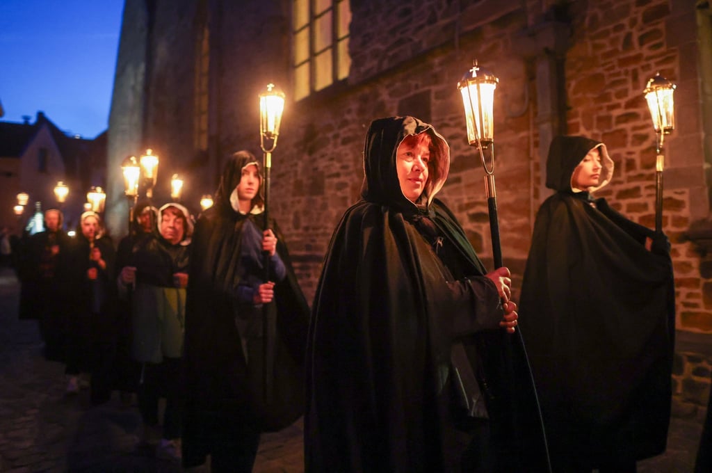 People take part in The Black Penitents procession on its 550th anniversary during Good Friday in Lessines, Belgium, on April 18. Photo: EPA-EFE People take part in The Black Penitents procession on its 550th anniversary during Good Friday in Lessines, Belgium, on April 18. Photo: EPA-EFE