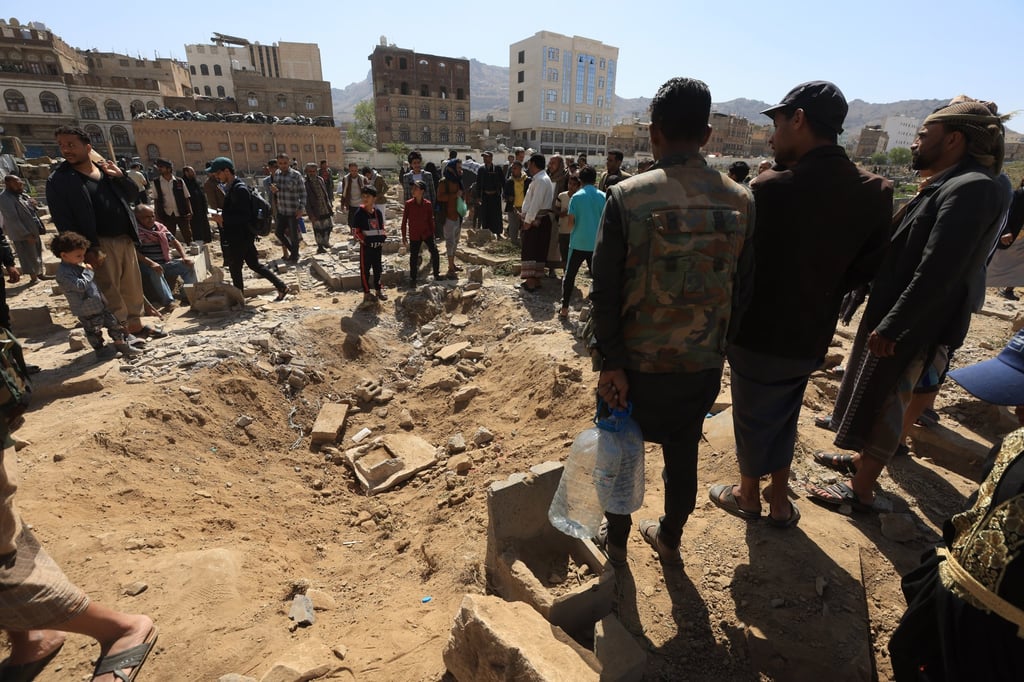 People inspect the site of a US air strike at a cemetery in Sanaa, Yemen, on Sunday. Photo: EPA-EFE People inspect the site of a US air strike at a cemetery in Sanaa, Yemen, on Sunday. Photo: EPA-EFE
