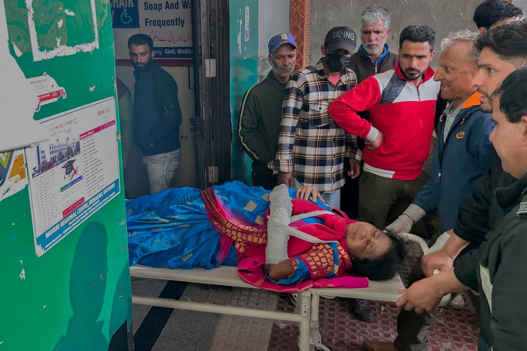 Paramedics carry a wounded tourist on a stretcher at a hospital in Anantnag after an attack in Indian-controlled Kashmir on Tuesday. Photo: AP Paramedics carry a wounded tourist on a stretcher at a hospital in Anantnag after an attack in Indian-controlled Kashmir on Tuesday. Photo: AP