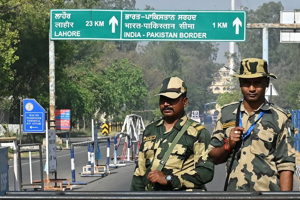 Indian Border Security Force soldiers stand guard at the entrance of the India-Pakistan Wagah border post. Photo: AFP