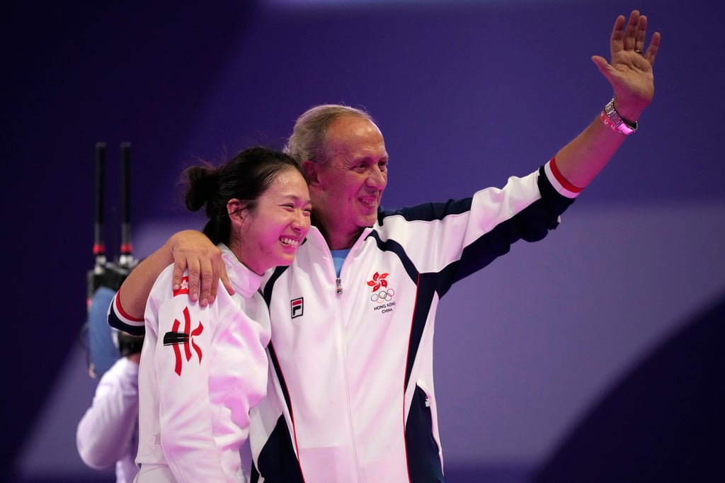 Octavian Zidaru celebrates with Vivian Kong after the Hongkonger claimed Olympic fencing gold. Photo: AP Octavian Zidaru celebrates with Vivian Kong after the Hongkonger claimed Olympic fencing gold. Photo: AP