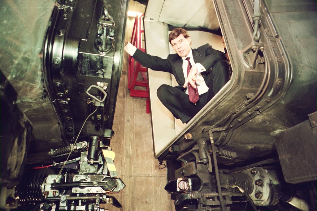 John Gretton of the MTRC points out the new yellow and black locking device that were rolled out across all trains following the decoupling incident. Photo: SCMP Archives