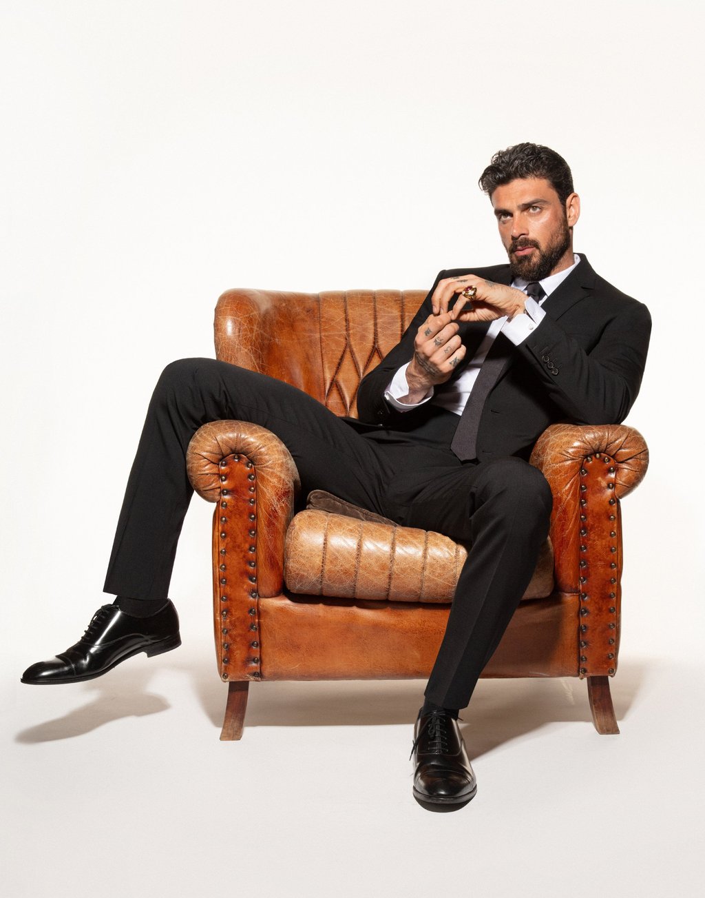 Michele Morrone photographed for Style by Mike Ruiz. Dsquared²: suit, shirt, tie, shoes; Intimissimi Uomo: socks
