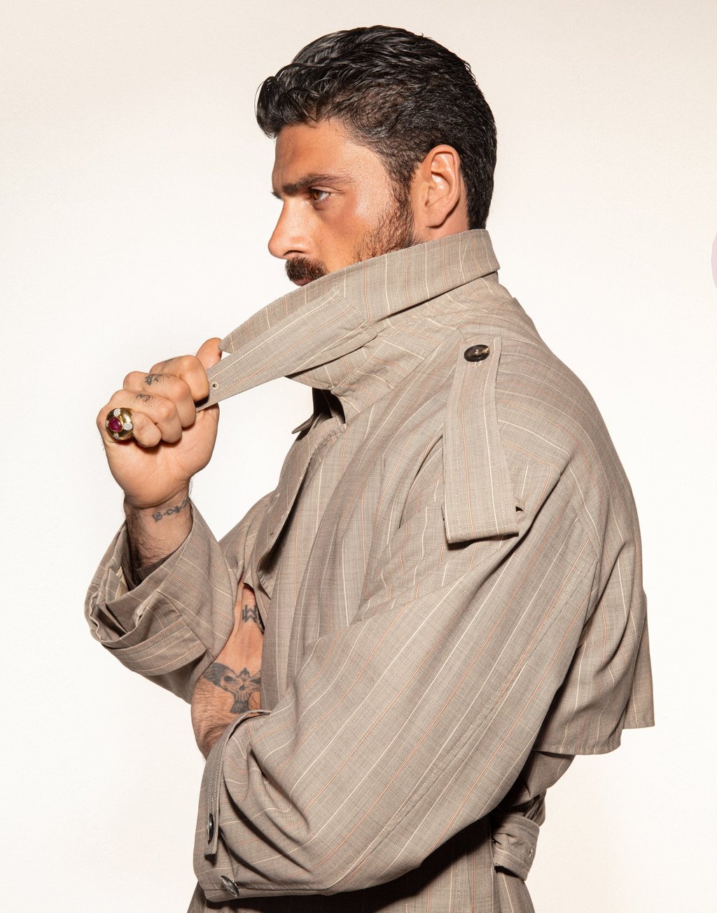 Emporio Armani: overcoat. The ring is Michele Morrone’s own