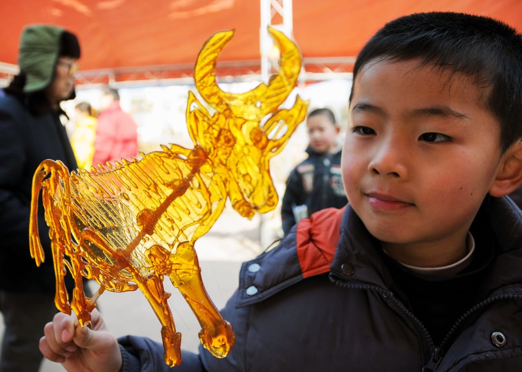 A child views a sugar painting of an ox at Xinghua Park in Hefei, east China’s Anhui province. Oxen may face increased work pressure this month. Photo: Xinhua A child views a sugar painting of an ox at Xinghua Park in Hefei, east China’s Anhui province. Oxen may face increased work pressure this month. Photo: Xinhua