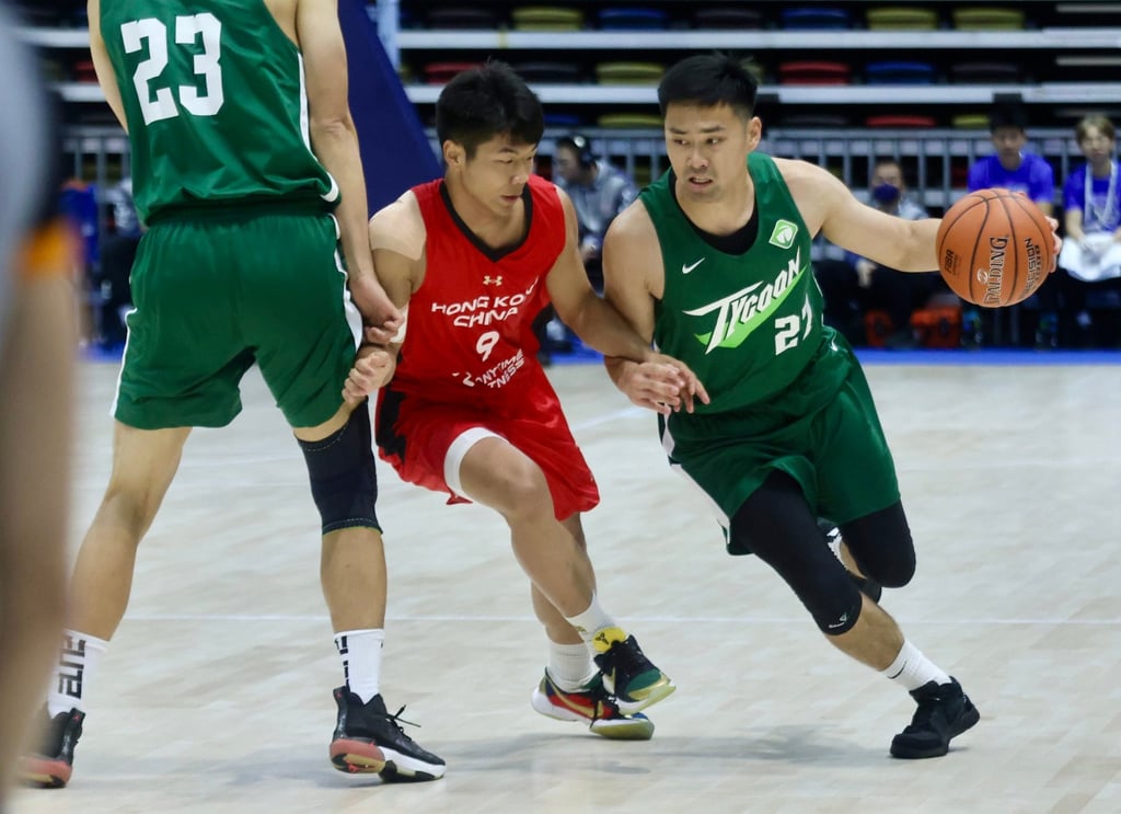 Hong Kong under-22’s Chung Chi-wing (left) tries to defend against Tycoon’s Tsai Choi-kwan during the National Games test event at the Coliseum. Photo: Jonathan Wong