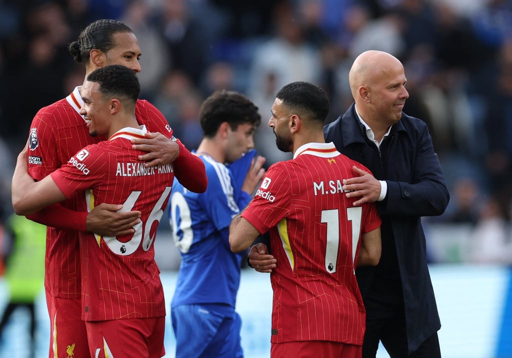 From left, Virgil van Dijk, Trent Alexander-Arnold and Mohamed Salah with Arne Slot. Photo: Reuters