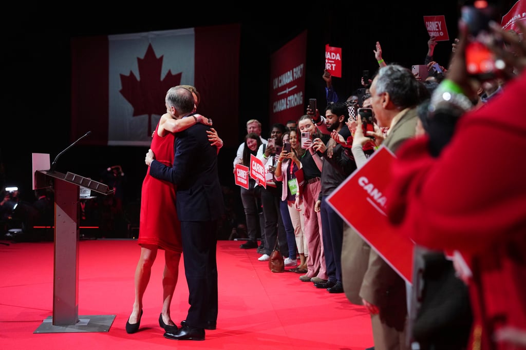 Canadian Prime Minister Mark Carney embraces his wife Diana Fox Carney. Photo: The Canadian Press via AP