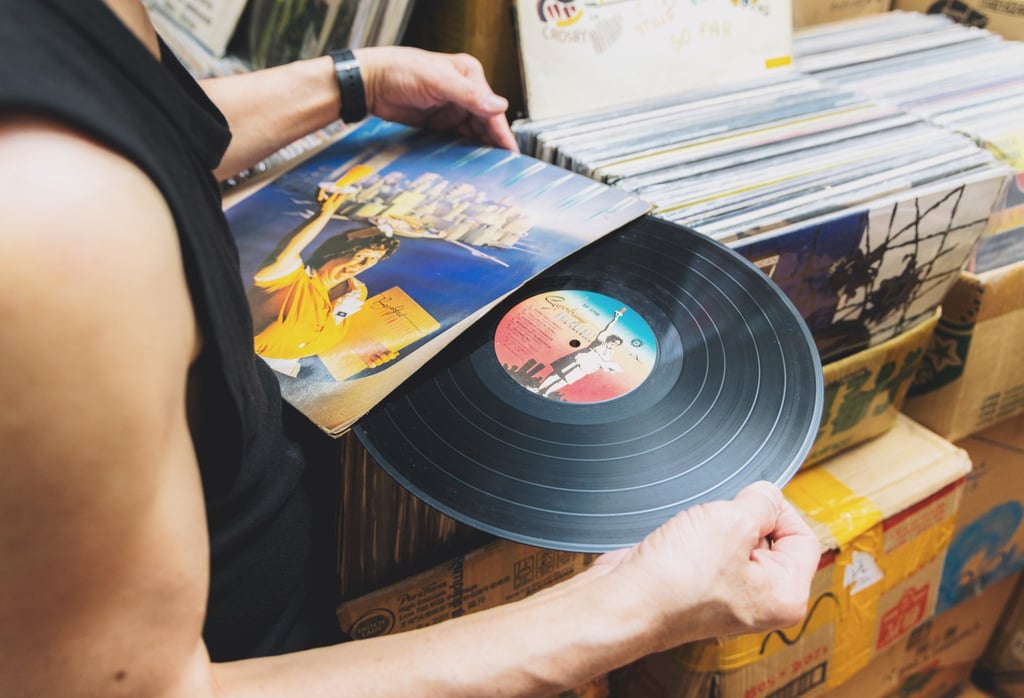 Paul Au takes a vinyl record from its sleeve at his store. Photo: Jocelyn Tam Paul Au takes a vinyl record from its sleeve at his store. Photo: Jocelyn Tam