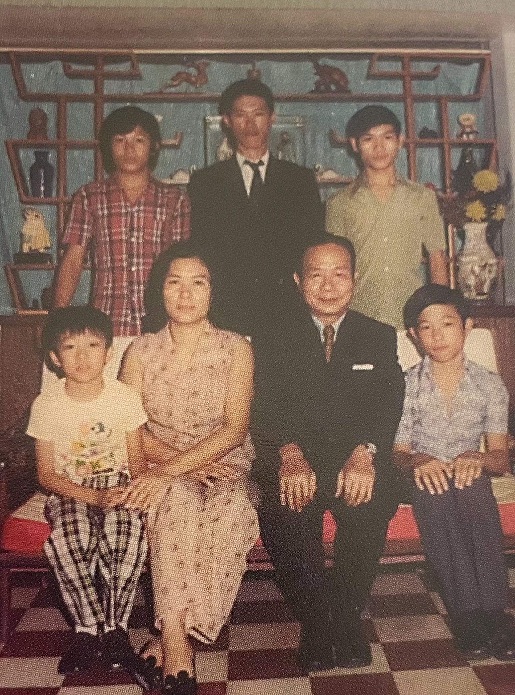 Au (top right) with his parents, older half-brother (top centre) and three younger brothers, in 1974, just before he escaped to Hong Kong. Photo: courtesy Paul Au Au (top right) with his parents, older half-brother (top centre) and three younger brothers, in 1974, just before he escaped to Hong Kong. Photo: courtesy Paul Au