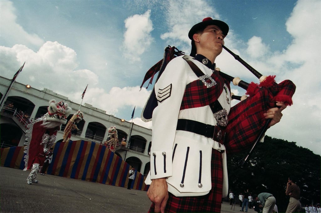 Sergeant Edward Lam Yat-sing of the Royal Hong Kong Police Force Band wears the Mackintosh tartan for a rehearsal. Photo: SCMP