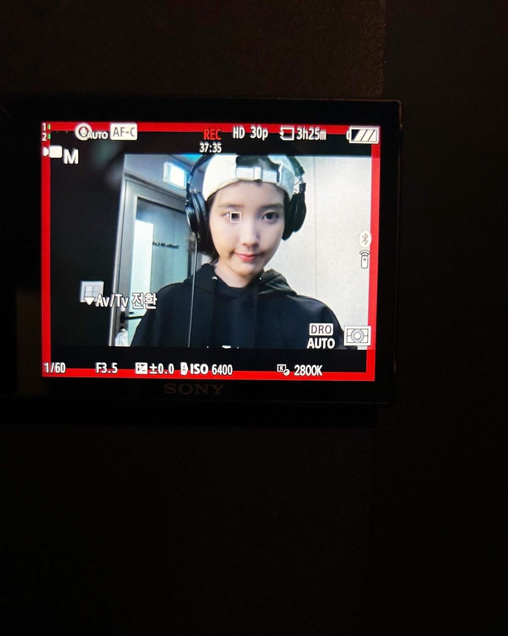 In one image, IU is wearing a headset in what appears to be a recording studio. Photo: Instagram/dlwlrma