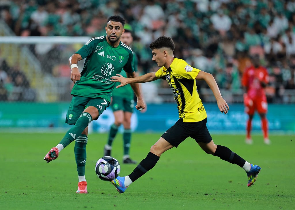 Al-Ahli’s Riyad Mahrez (left) reportedly earns US$59 million, three times the Kawasaki wage bill. Photo: Reuters