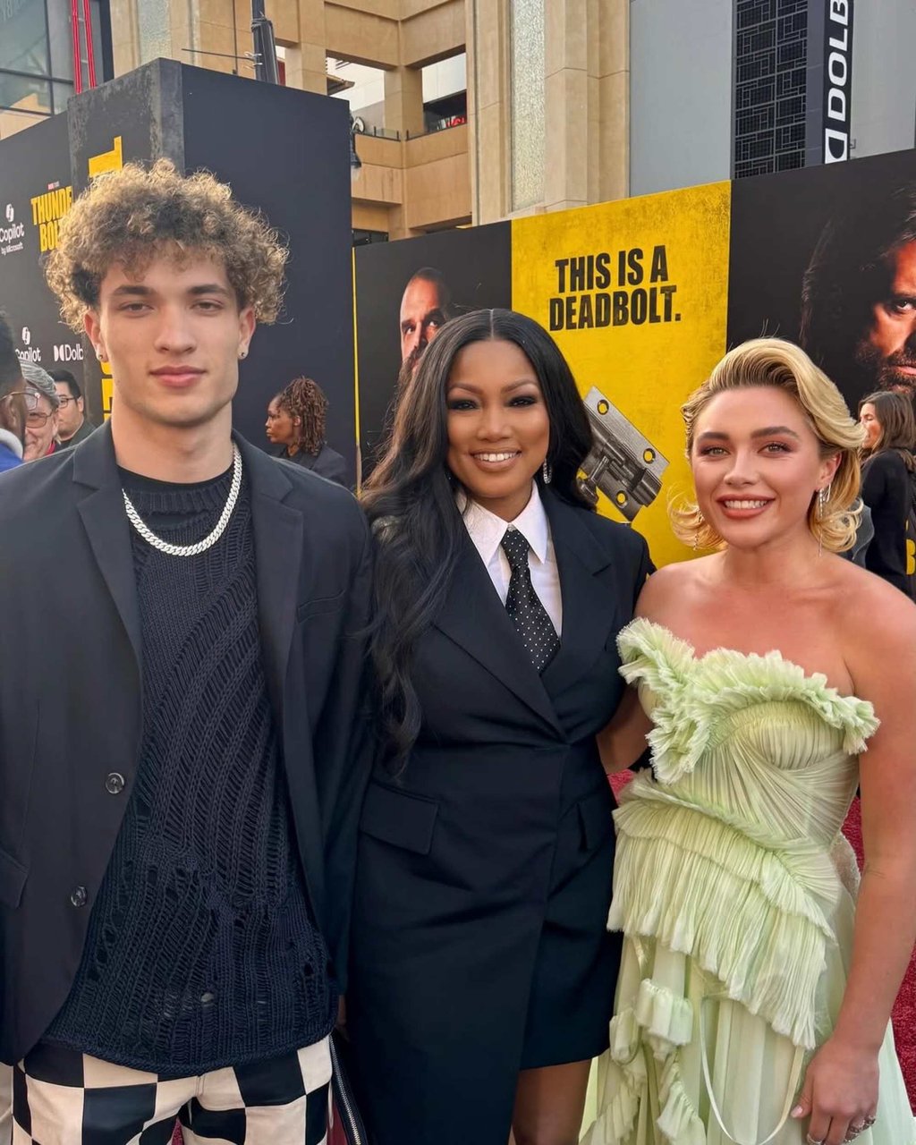 Jaid Thomas Nilon, left, with mother Garcelle Beauvais, centre, and actress Florence Pugh, right. Photo: @garcelle/Instagram