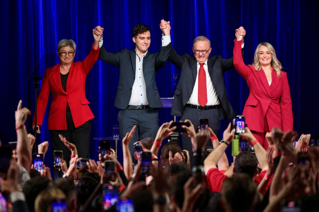 Australia’s Prime Minister Anthony Albanese celebrates with his partner Jodie Haydon (right), his son Nathan and Minister for Foreign Affairs Penny Wong at a Labor party election night event. Photo: Reuters Australia’s Prime Minister Anthony Albanese celebrates with his partner Jodie Haydon (right), his son Nathan and Minister for Foreign Affairs Penny Wong at a Labor party election night event. Photo: Reuters