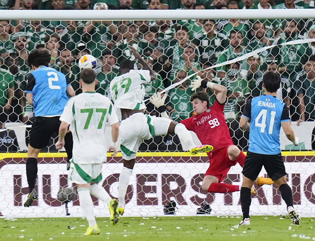 Franck Kessie heads home Al-Ahli’s second goal off past Kawasaki keeper Louis Yamaguchi. Photo: Kyodo