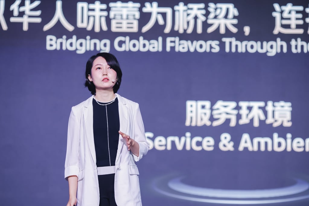 Tang Yan, the head of the Black Pearl Restaurant Guide, addresses guests at the awards ceremony at Singapore’s Marina Bay Sands complex. Photo: Meituan