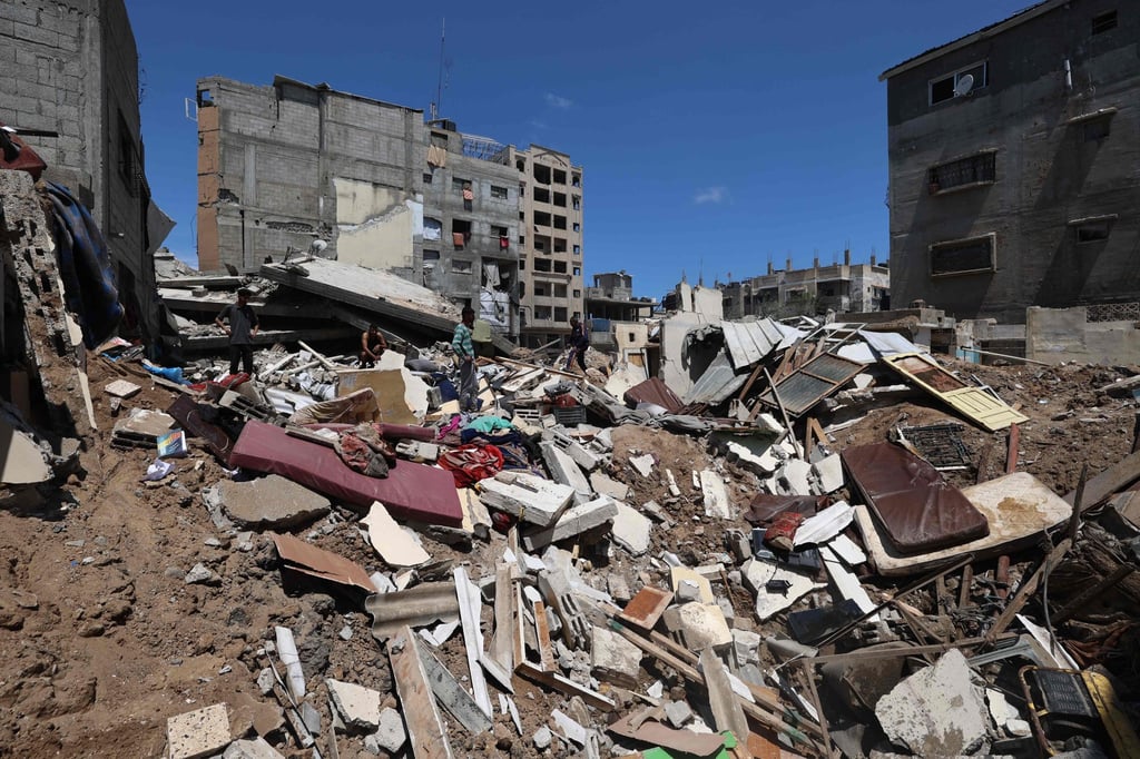 Palestinians inspect damage following overnight Israeli strikes in the central Gaza Strip on Sunday. Photo: AFP Palestinians inspect damage following overnight Israeli strikes in the central Gaza Strip on Sunday. Photo: AFP