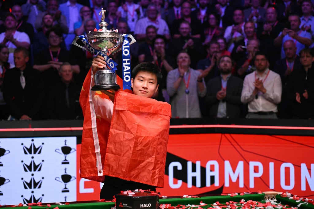 Zhao Xintong holds the trophy after his Crucible victory over Wales’ Mark Williams. Photo: AFP Zhao Xintong holds the trophy after his Crucible victory over Wales’ Mark Williams. Photo: AFP