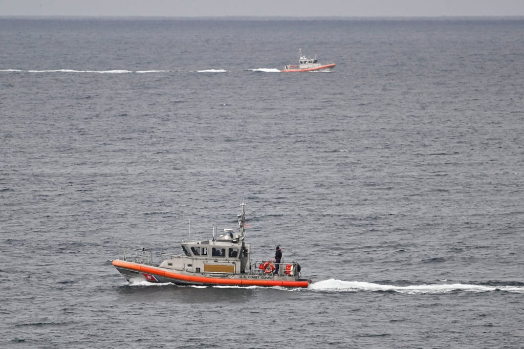 US Coast Guard boats search for survivors. Photo: AP