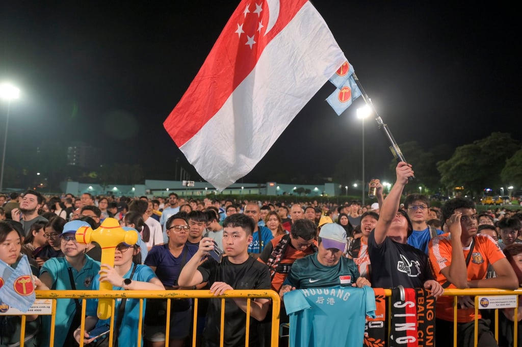 Supporters of the opposition Workers’ Party listening to a speech on Saturday night as preliminary results trickled in. Photo: EPA-EFE Supporters of the opposition Workers’ Party listening to a speech on Saturday night as preliminary results trickled in. Photo: EPA-EFE