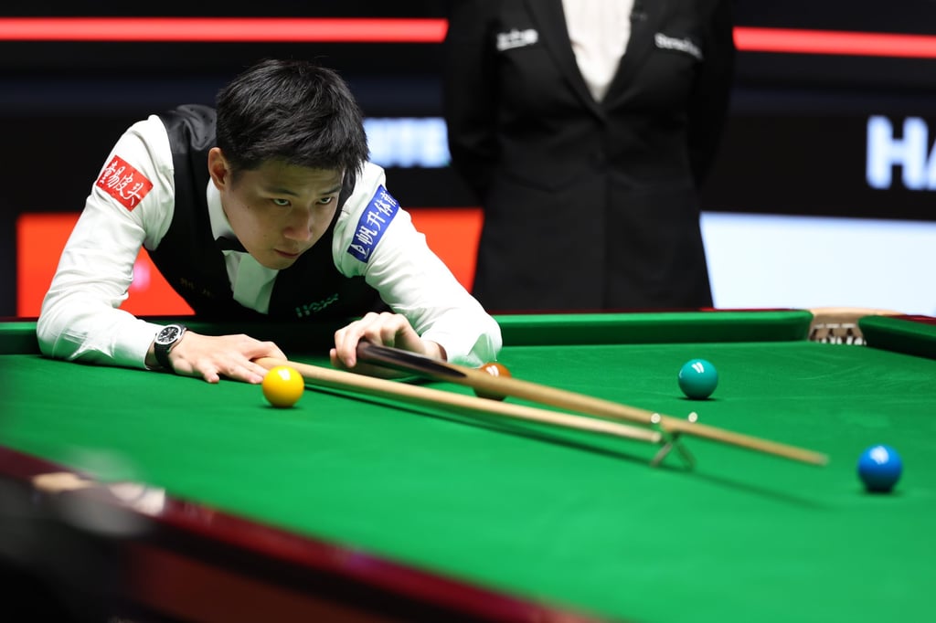 Zhao Xintong in action during the World Snooker Championship final on Monday. Photo: Xinhua