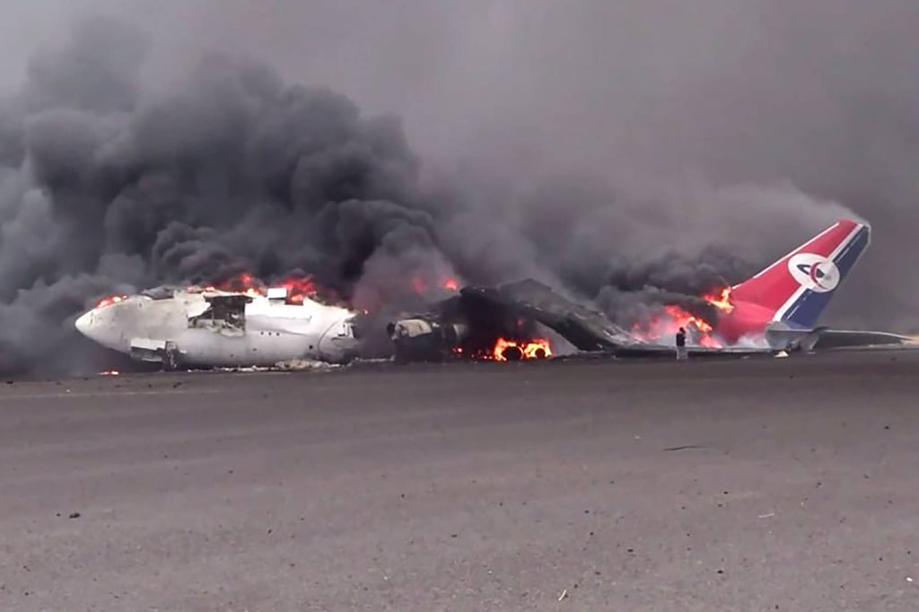 A burning plane at Sanaa international airport. Photo: SANA via AFP