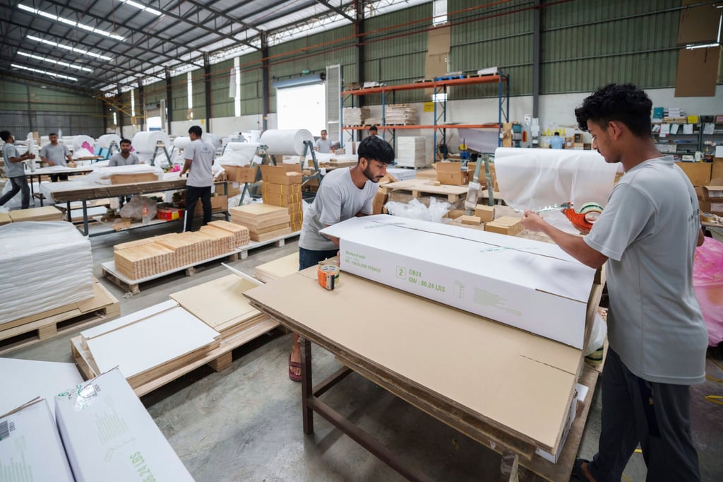 Workers pack furniture for shipping to the United States at a factory on the outskirts of Muar, in Malaysia’s Johor state, in April. Photo: AP Workers pack furniture for shipping to the United States at a factory on the outskirts of Muar, in Malaysia’s Johor state, in April. Photo: AP
