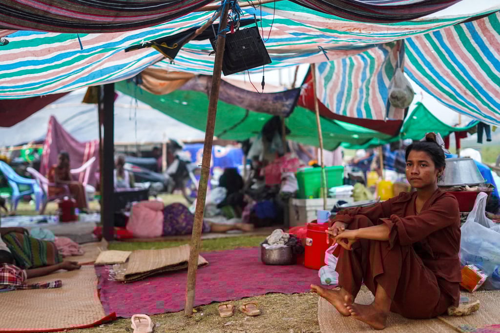 A woman sits inside a shelter in a makeshift tent camp following a strong earthquake in Myanmar. Photo: AP A woman sits inside a shelter in a makeshift tent camp following a strong earthquake in Myanmar. Photo: AP