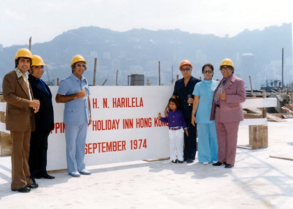The Harilela family stands before the building site of the Holiday Inn Golden Mile in Hong Kong in 1974, the year before the Harilela Group’s flagship property opened to the public. Photo: Harilela Hotels
