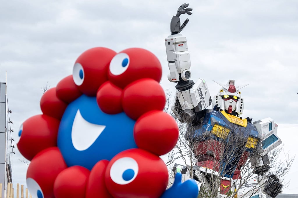 The “Myaku-Myaku”, the mascot of the 2025 Osaka Expo, and the Gundam pavilion seen on the first day of the expo on April 13. Photo: AFP The “Myaku-Myaku”, the mascot of the 2025 Osaka Expo, and the Gundam pavilion seen on the first day of the expo on April 13. Photo: AFP