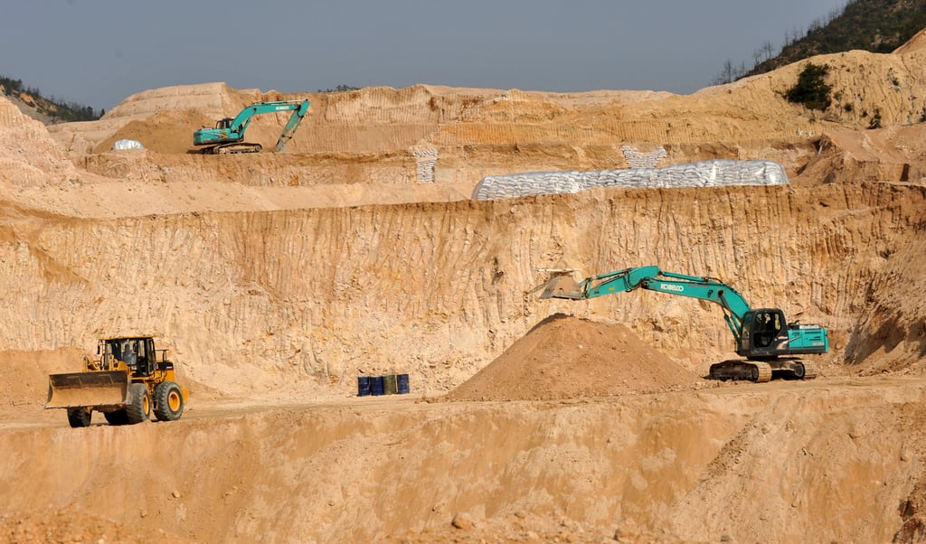 Heavy machinery works a rare earth mine in central China’s Jiangxi province. Photo: AP Heavy machinery works a rare earth mine in central China’s Jiangxi province. Photo: AP