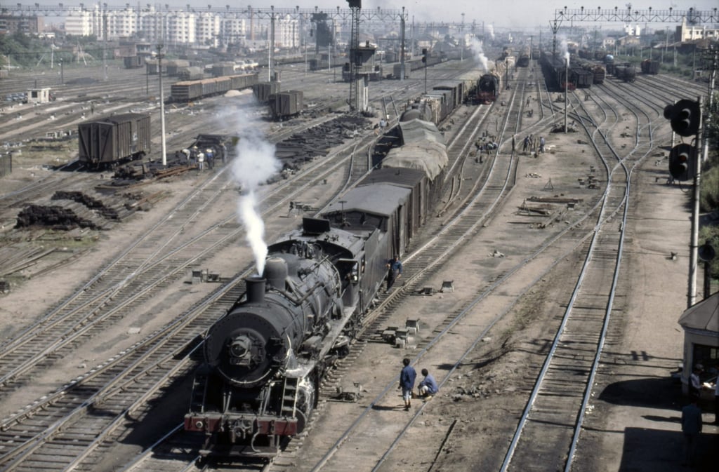 The marshalling yard at Harbin in northern China was filled with steam trains in the 1980s, when Paul Theroux wrote travelogue Riding the Iron Rooster. Photo: Getty Images