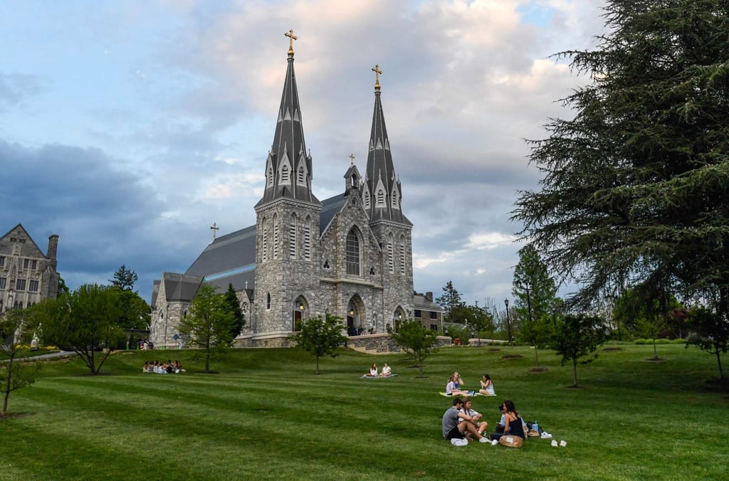 Students sit on the lawn outside St. Thomas of Villanova Church at the campus of Villanova University. The university celebrated as alumnus Cardinal Prevost became Pope Leo XIV. Photo: AFP Students sit on the lawn outside St. Thomas of Villanova Church at the campus of Villanova University. The university celebrated as alumnus Cardinal Prevost became Pope Leo XIV. Photo: AFP