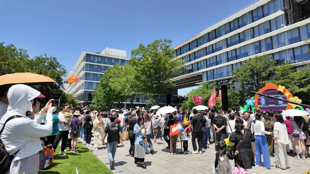 Visitors tour the company’s campus in Hangzhou on AliDay, which features photo booths, mascot parades, matchmaking sessions and other activities. Photo: Wency Chen Visitors tour the company’s campus in Hangzhou on AliDay, which features photo booths, mascot parades, matchmaking sessions and other activities. Photo: Wency Chen