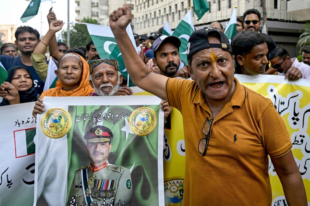 Demonstrators hold a banner with a portrait of Pakistan’s Chief of Army Staff General Syed Asim Munir during an anti-India protest in Karachi on Saturday. Photo: AFP Demonstrators hold a banner with a portrait of Pakistan’s Chief of Army Staff General Syed Asim Munir during an anti-India protest in Karachi on Saturday. Photo: AFP