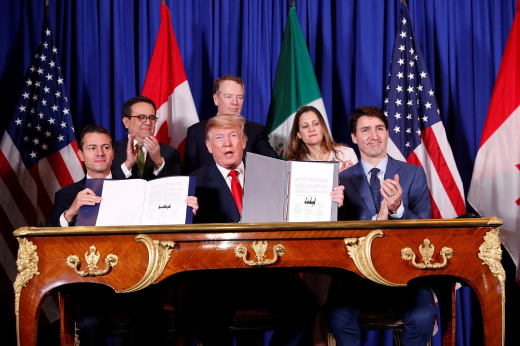 From the left, then-Mexican president Enrique Pena Nieto, US President Donald Trump and then-Canadian prime minister Justin Trudeau attend the USMCA signing ceremony in Buenos Aires, Argentina, on November 30, 2018. Photo: Reuters