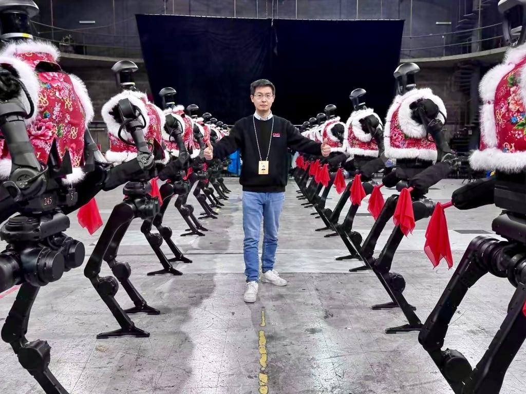 Wang Xingxing, founder and chief executive of Unitree Robotics, poses with the company’s H1 general-purpose humanoid robots that performed Chinese folk dance Yanggea during the annual Spring Festival Gala show in January. Photo: Weibo Wang Xingxing, founder and chief executive of Unitree Robotics, poses with the company’s H1 general-purpose humanoid robots that performed Chinese folk dance Yanggea during the annual Spring Festival Gala show in January. Photo: Weibo