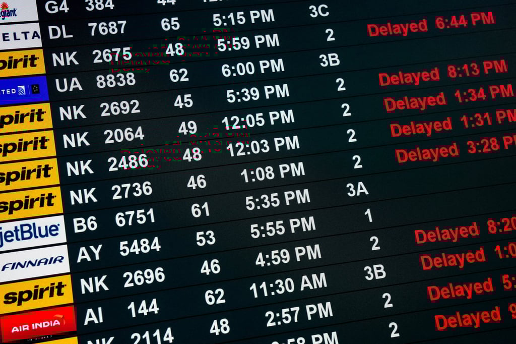 A screen displays delayed flights at Newark Liberty International Airport last week. Photo: Reuters A screen displays delayed flights at Newark Liberty International Airport last week. Photo: Reuters