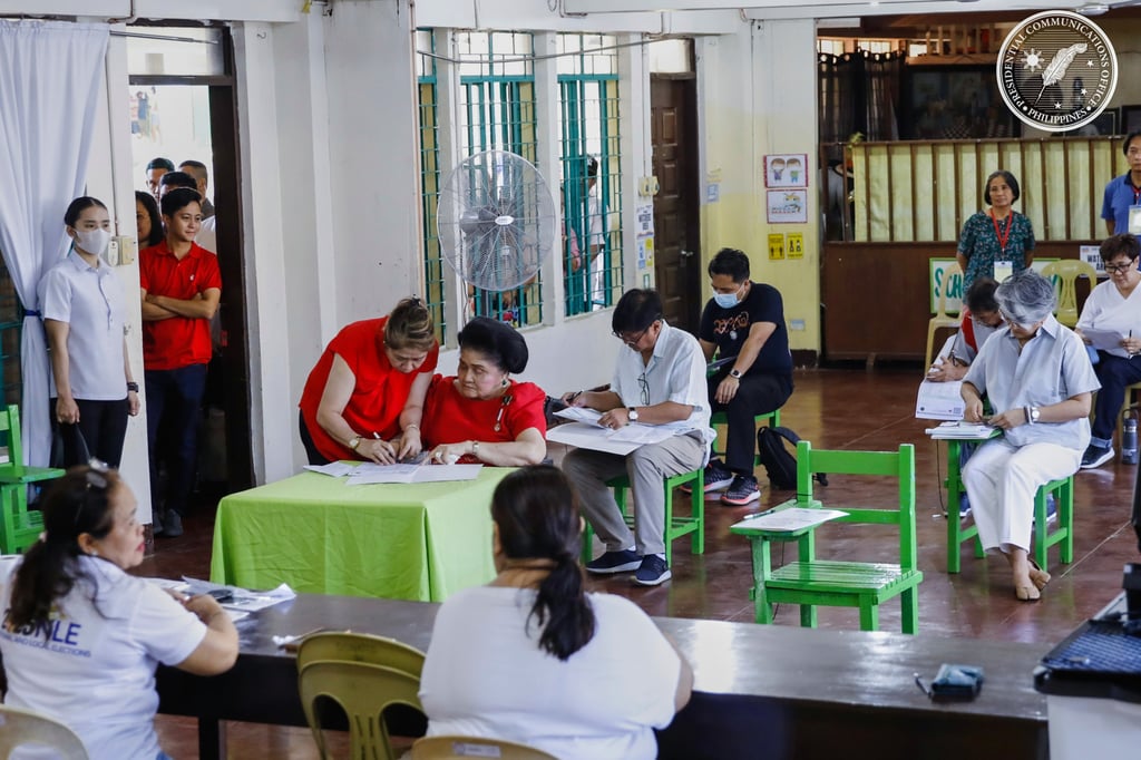 Philippine President Ferdinand Marcos Jnr, centre right, and his mother, former first lady Imelda Marcos, centre left, prepare to cast their votes at a polling station in Batac City, Ilocos Norte province, on Monday. Photo: AP Philippine President Ferdinand Marcos Jnr, centre right, and his mother, former first lady Imelda Marcos, centre left, prepare to cast their votes at a polling station in Batac City, Ilocos Norte province, on Monday. Photo: AP