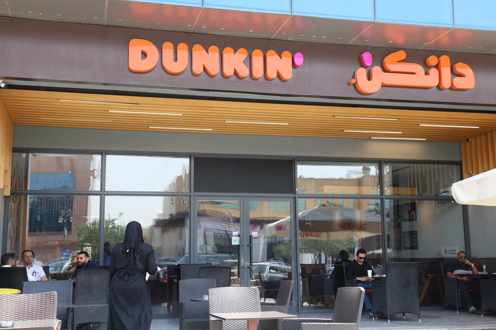People sit at a Dunkin’ coffee shop in Riyadh. Photo: AFP People sit at a Dunkin’ coffee shop in Riyadh. Photo: AFP