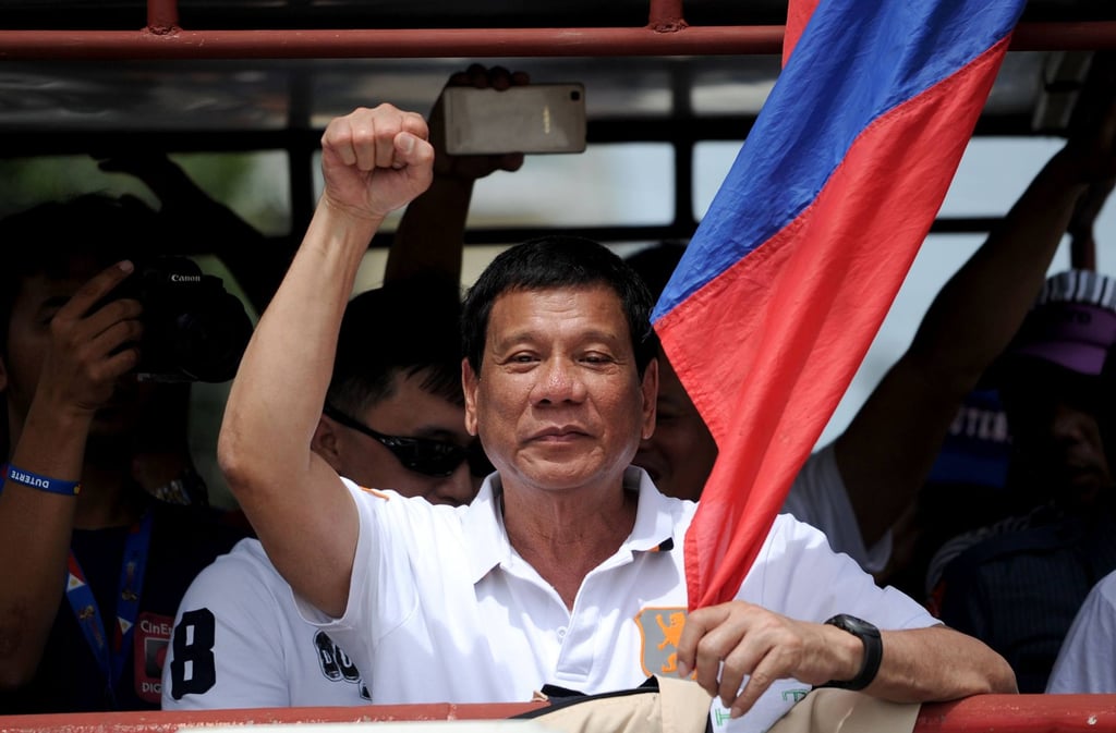 Then-Davao City mayor Duterte raises a clenched fist to supporters while campaigning for the Philippine presidency in 2016. Photo: AFP Then-Davao City mayor Duterte raises a clenched fist to supporters while campaigning for the Philippine presidency in 2016. Photo: AFP