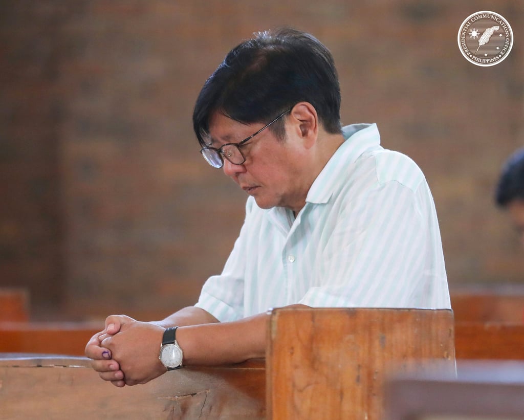 Philippine President Ferdinand Marcos Jnr prays as he visits a church before casting his vote in Batac City, Ilocos Norte province, on Monday. Photo: Malacanang Presidential Communications Office via AP